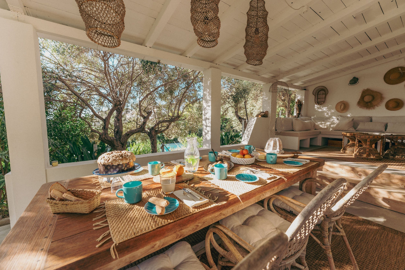 Breakfast table laid on a shaded terrace at Il Polpo Nero villa in Sardinia, illustrating dining on your own schedule with no fixed hours.
