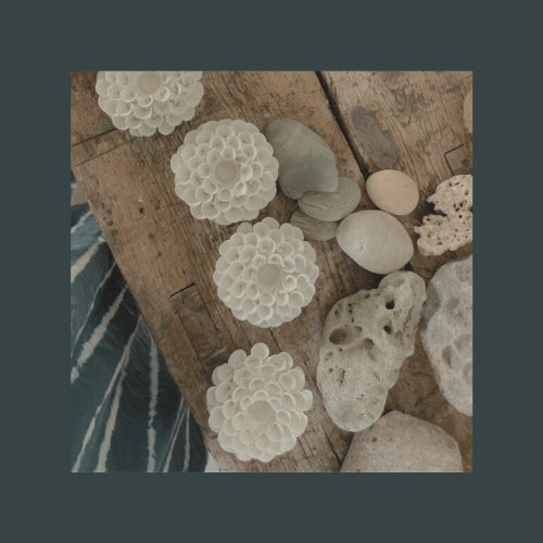 Locally crafted ceramic decorations and natural stones at Il Polpo Nero, a sea view villa in South Sardinia, reflecting authentic Mediterranean artistry and coastal charm.